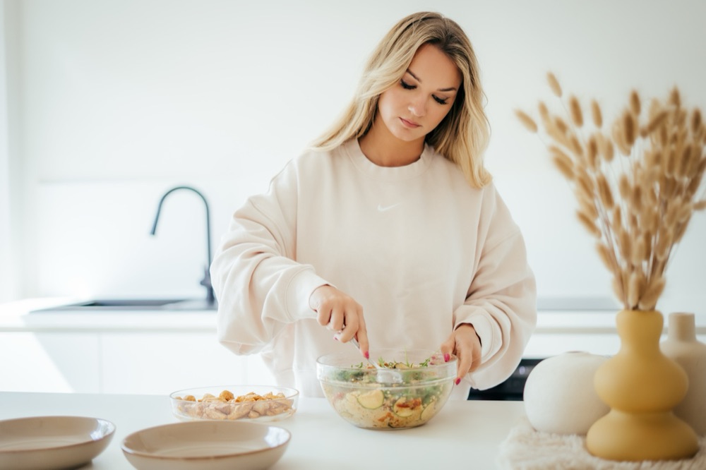 Charro making a salad in her kitchen